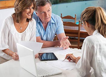 A couple is getting tax service from a knowledgeable professional